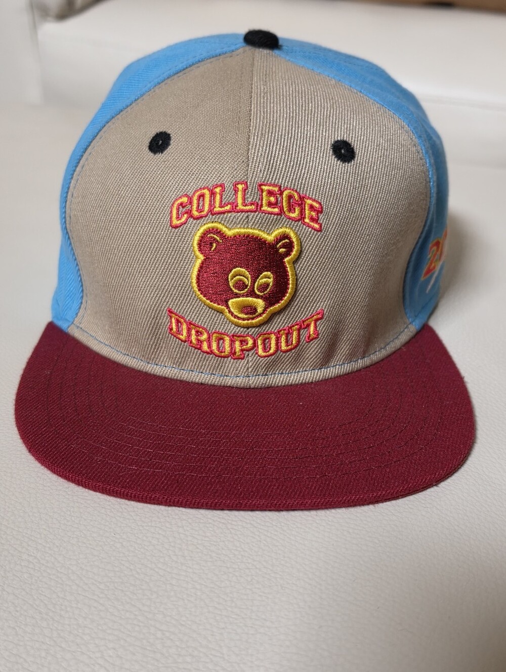 Contemporary snapback cap celebrating Kanye West’s 2004 debut studio album, EUC